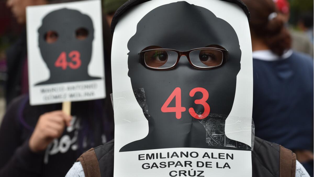 A silhouette with space for eye-holes turns this simple placard into a mask — and every protester at a demonstration in Mexico city last month into one of the missing.