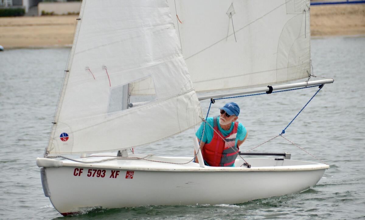 Rick MacMahon sails solo in a Lido 14 during his class at OCC's sailing school.