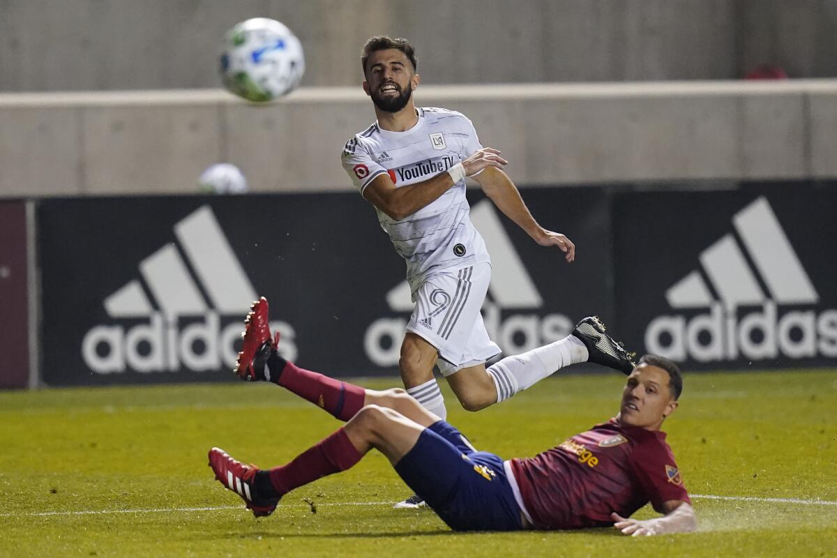 LAFC forward Diego Rossi passes the ball in front of Real Salt Lake defender Donny Toia.