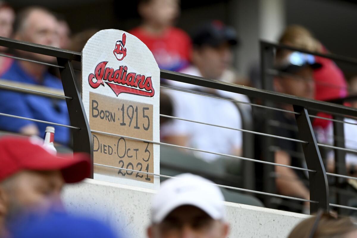 A tombstone-shaped sign that features the Chief Wahoo and reads "Indians, Born 1915, Died Oct. 3, 2021" is displayed.