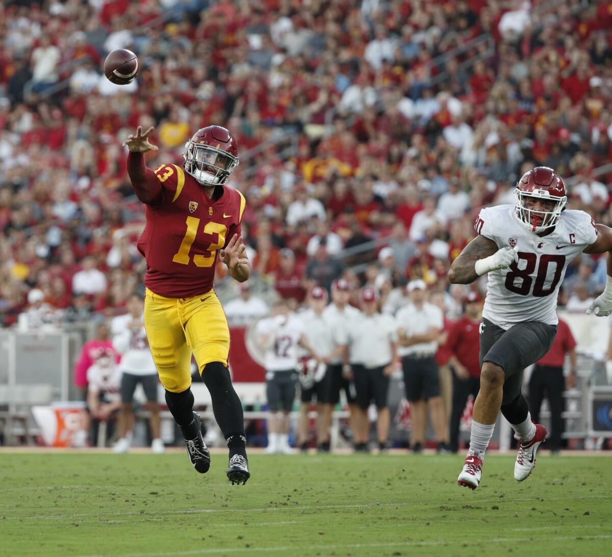 USC quarterback Caleb Williams throws on the run against Washington State on Oct. 8, 2022. 