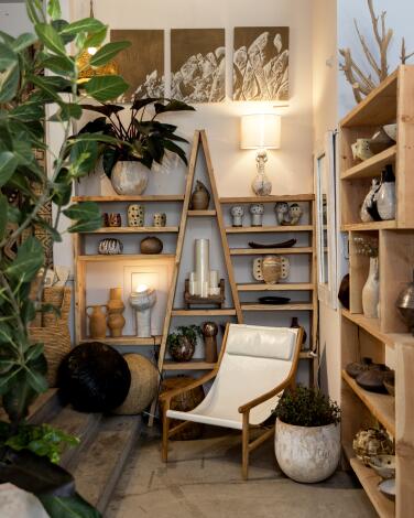 An assortment of store-made plant arrangements, store-designed outdoor furniture and local artisan pottery is seen at Acme 5 Lifestyle in Santa Monica, Calif., on May 15, 2025. (Alisha Jucevic/For The Times)