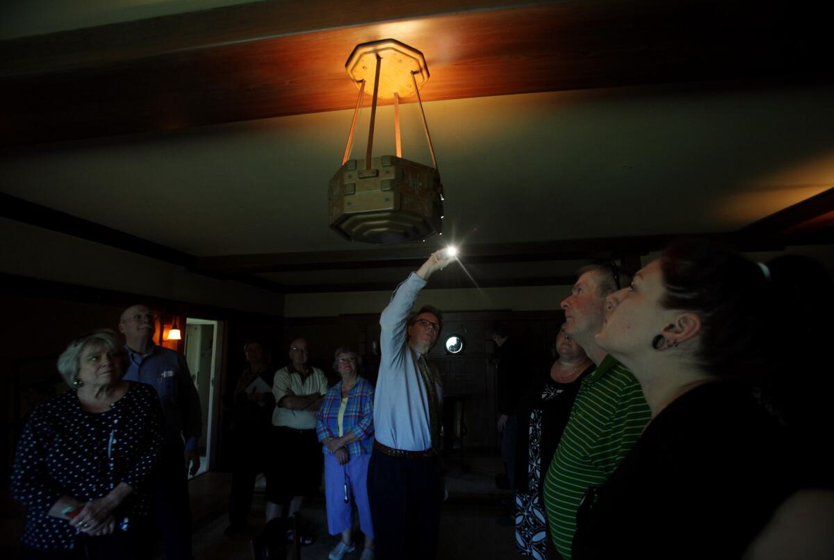 Docent Michael Murray, middle, leads a "Behind the Velvet Ropes" tour at the Gamble House in Pasadena.