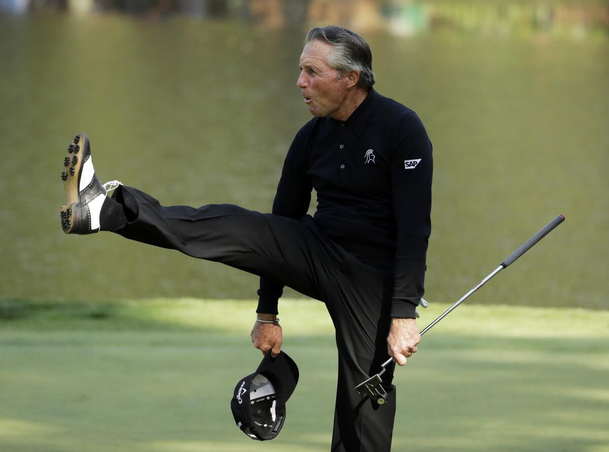 Gary Player is still limber enough to enjoy himself after making a birdie during the par-three tournament at the Masters last spring.