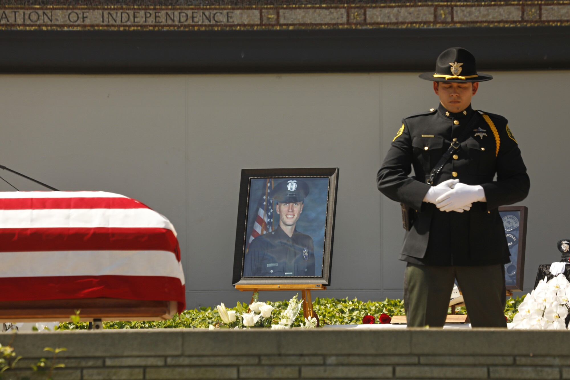 A picture is displayed of Officer Houston R. Tipping at his funeral 