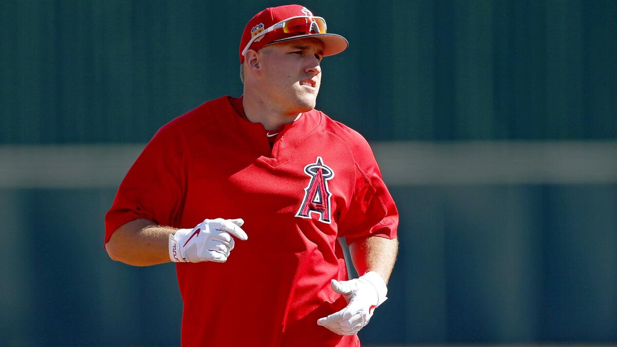 Angels center fielder Mike Trout rounds the bases during a recent spring training workout.