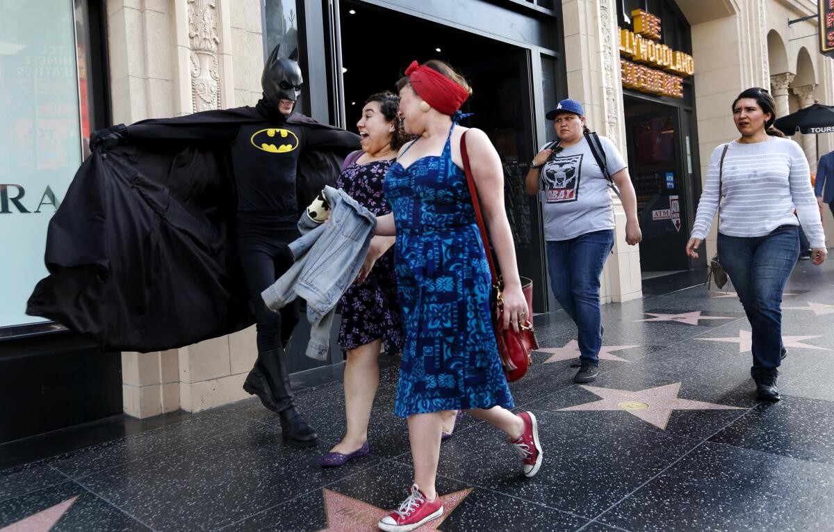 Austin Franklin, a.k.a. Batman, impresses at least some passers-by with his performance as the Caped Crusader on the job on Hollywood Boulevard.