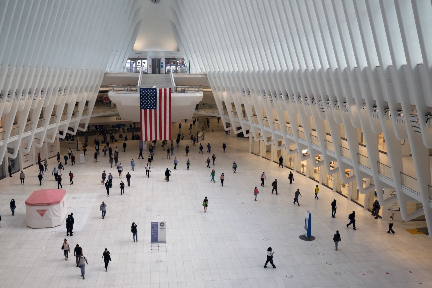 People walk through the Oculus transportation hub across from One World Trade Center