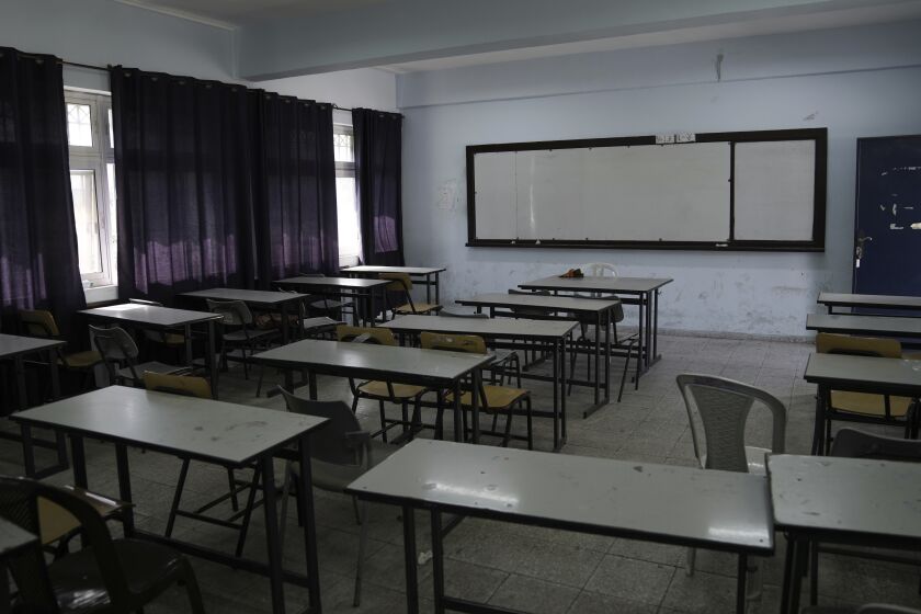 An empty classroom is seen in a school in the West Bank city of Bethlehem, Tuesday, March. 28, 2023. Palestinian public schools across the occupied West Bank have been shuttered since Feb. 5, in one of the longest teachers' strikes in recent memory against the cash-strapped Palestinian Authority.(AP Photo/Mahmoud Illean)