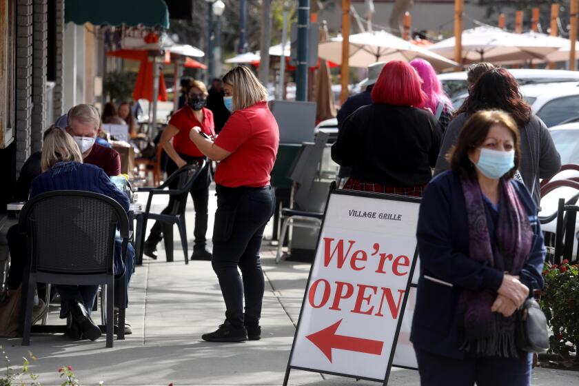 CLAREMONT, CA - People enjoy a meal as restaurants return to outdoor dining in The Village in downtown Claremont on Sunday, January 31, 2021. (Genaro Molina / Los Angeles Times)