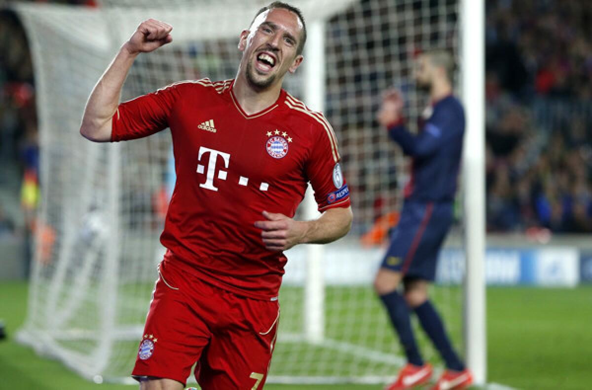 Bayern Munich's Franck Ribery celebrates after FC Barcelona defender Gerard Pique, background right, deflected a shot into the goal in the Champions League semifinal on Wednesday.