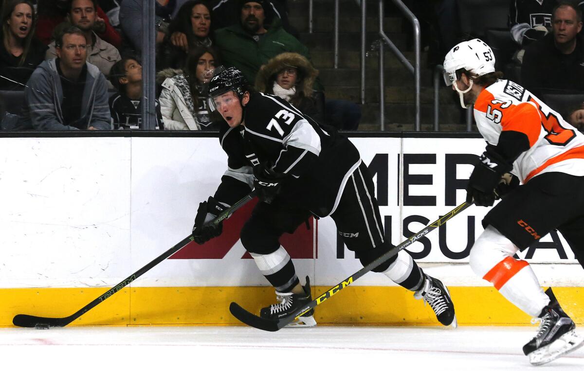 Kings center Tyler Toffoli brings the puck up ice against Flyers defenseman Shayne Gostisbehere in the third period Saturday.