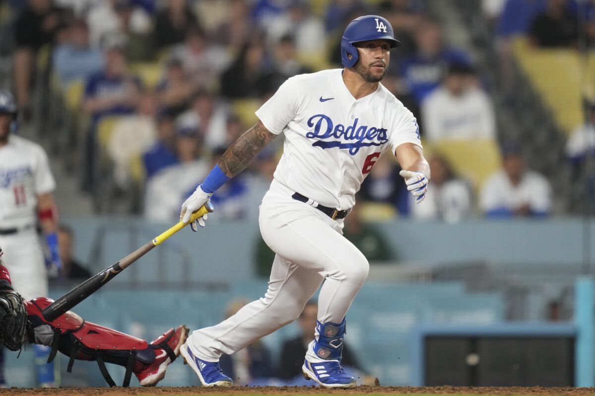 Dodgers' David Peralta doubles during the eighth inning against the Minnesota Twins at Dodger Stadium.