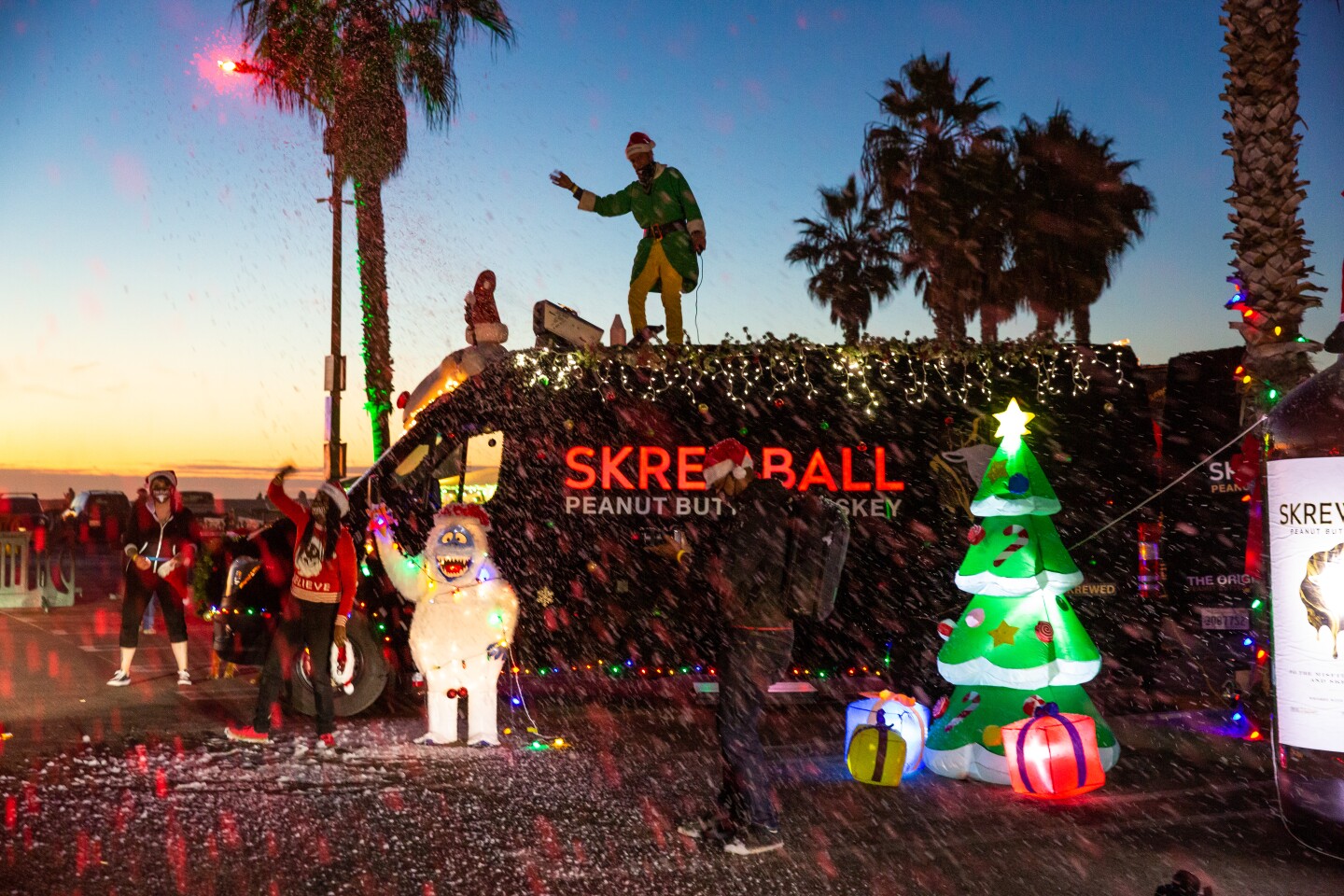 A crew from Skrewball whiskey gets in the holiday spirit during the Ocean Beach Holiday Parade on Dec. 5.