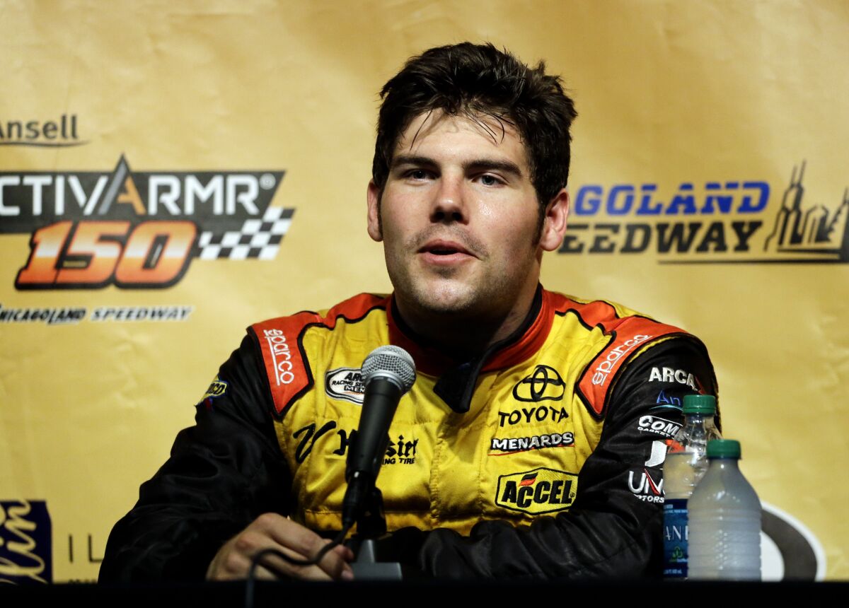 FILE - In this July 19, 2014, file photo, John Wes Townley speaks at a news conference after qualifying for the Arca Racing Series auto race at Chicagoland Speedway in Joliet, Ill. Former NASCAR driver Townley was killed Saturday, Oct. 2, 2021, in a shooting in Georgia that also wounded a woman, investigators said. Townley, 31, died in the shooting in a neighborhood around 9 p.m., Athens-Clarke County Coroner Sonny Wilson told the Athens Banner-Herald. (AP Photo/Nam Y. Huh, File)