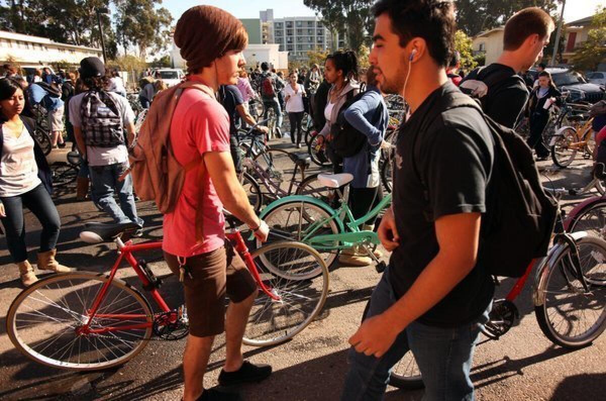 Students crowd the UC Santa Barbara bike racks. A survey of UC students found that 82% of those who answered were somewhat satisfied, satisfied or very satisfied with their overall academic experience.