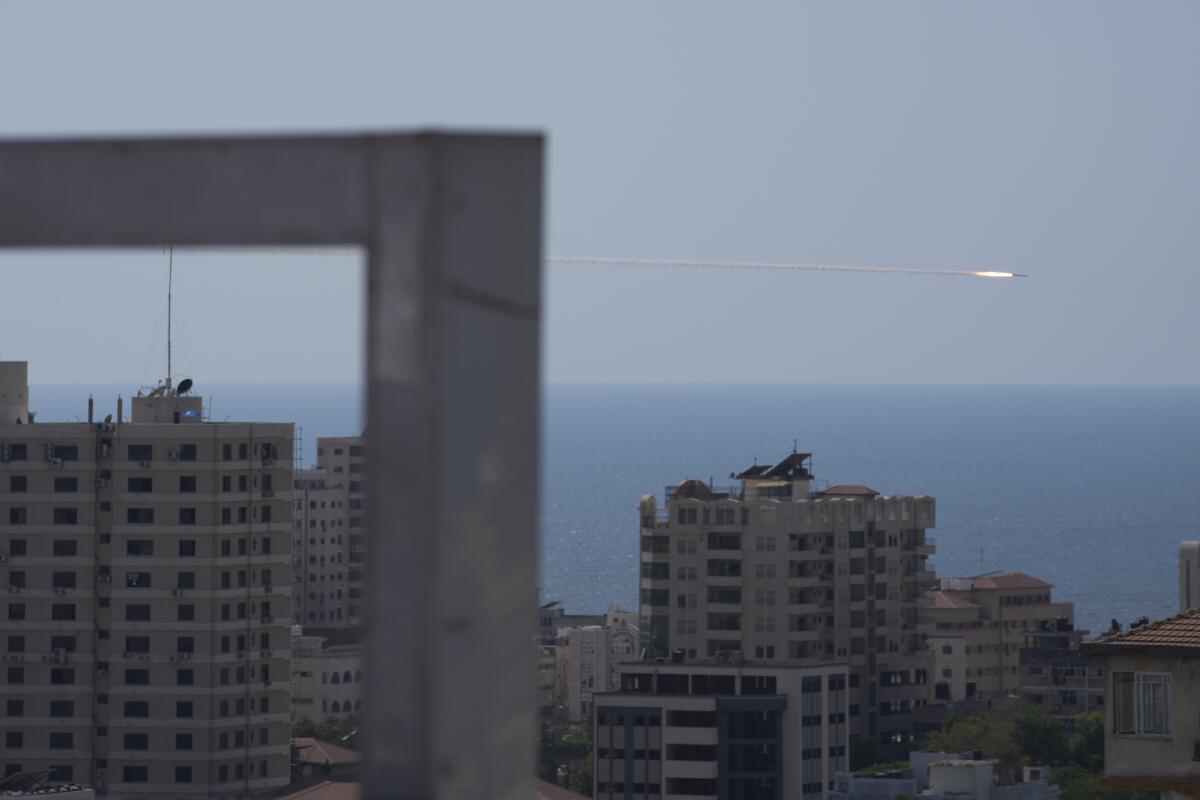 FILE - A rocket is launched from the Gaza Strip towards Israel, in Gaza City, Sunday, Aug. 7, 2022. Close to one-third of the Palestinians who died in the latest outbreak of violence between Israel and Gaza militants may have been killed by errant rockets fired by Islamic Jihad fighters, according to an Israeli military assessment that appears consistent with independent reporting by The Associated Press. (AP Photo/Hatem Moussa, File)