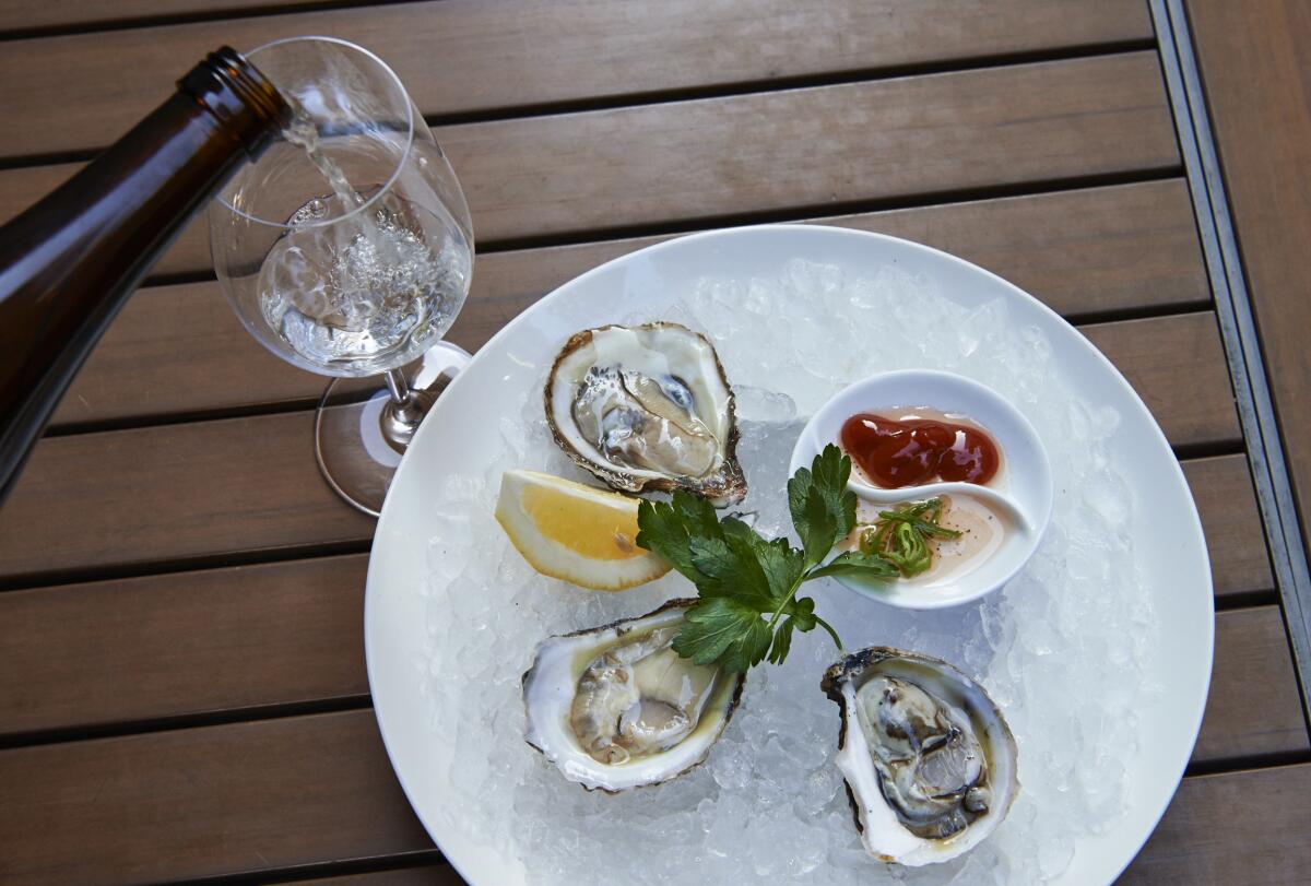 An extra burst of flavor comes from pairing fresh oysters with Japanese sake.