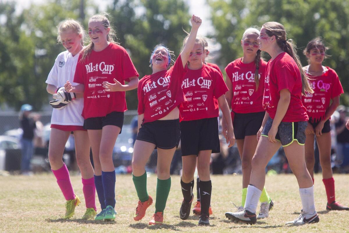 Kaiser celebrates after defeating Harbor Day in the girls’ 5-6 Gold Division championship game of the Daily Pilot Cup Sunday afternoon.