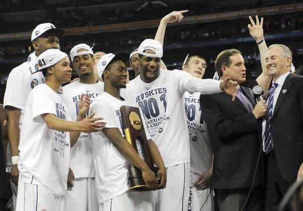 UConn Players Celebrate With Trophy