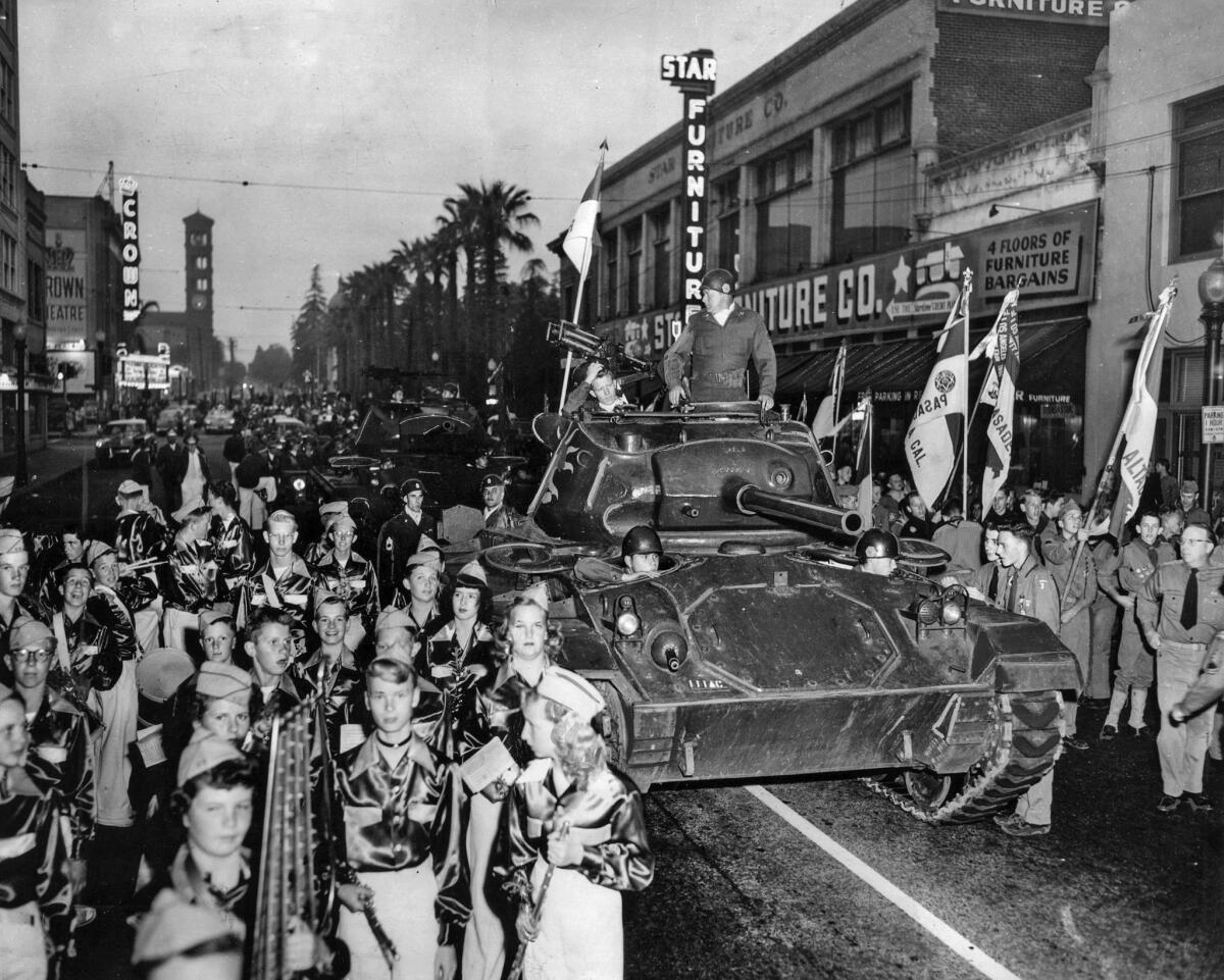May 29, 1952: An Army tank is flanked by Boy Scouts and a youth band in Pasadena's four-mile parade in a pre-Memorial Day event.