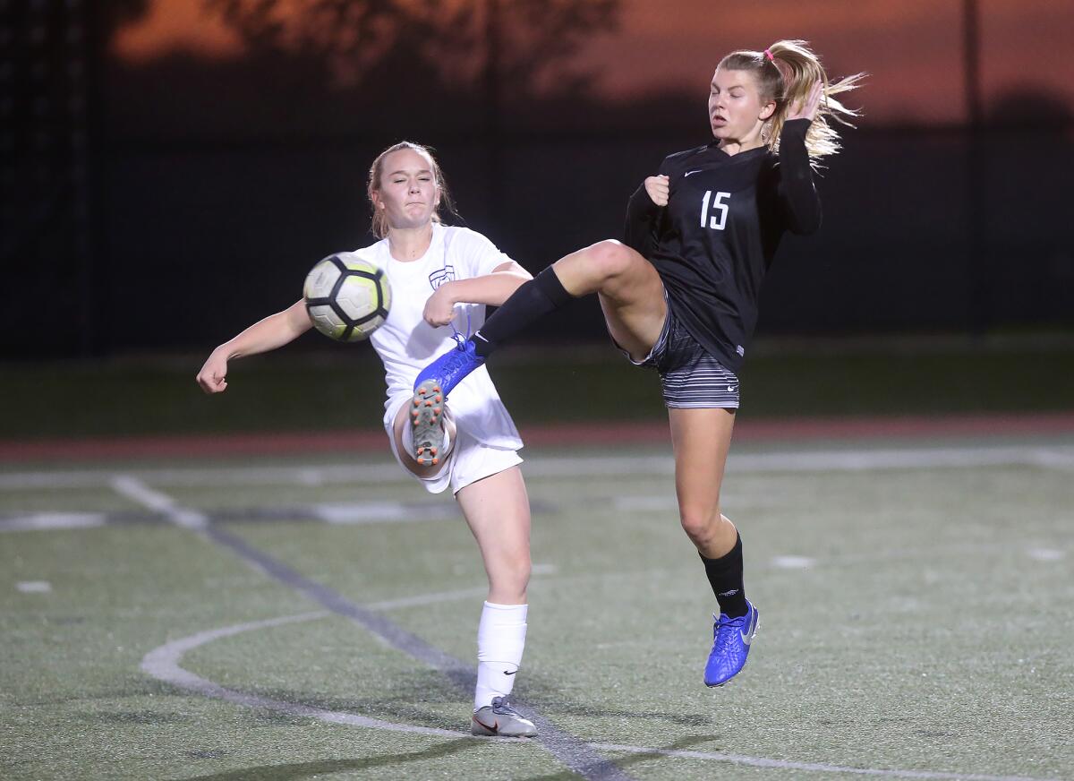 Sage Hill's Sofia Lowe (15) battles for the ball with Pacifica Christian Orange County's Lauren Roberts in a San Joaquin League match on Tuesday.