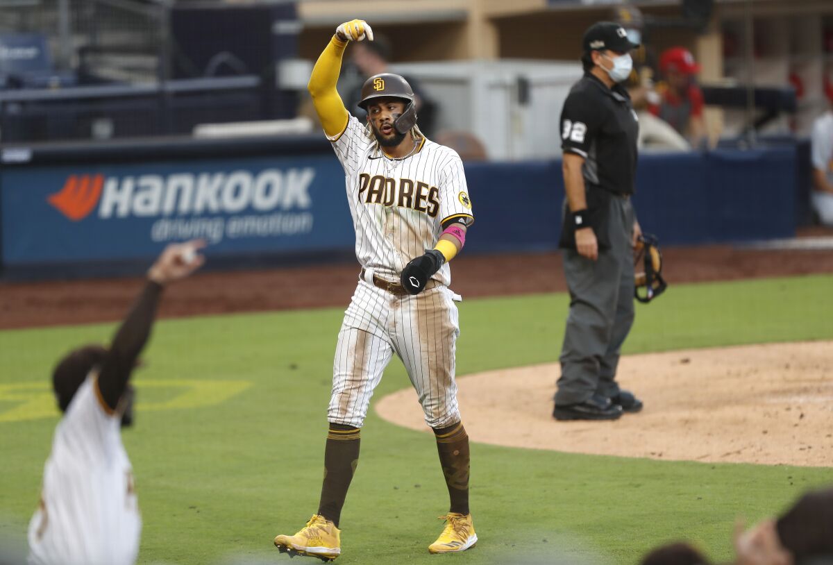 Fernando Tatis Jr. of the San Diego Padres scores on a double by Eric Hosmer in the 5th inning.