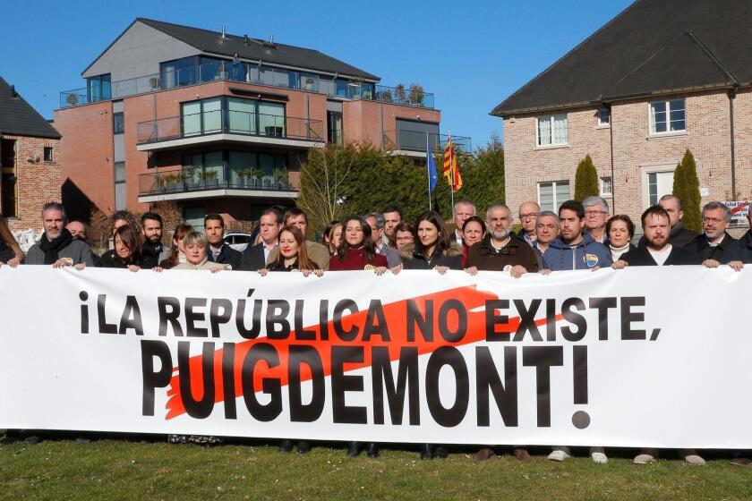 Mandatory Credit: Photo by JULIEN WARNAND/EPA-EFE/REX (10118261b) Spanish party Ciudadanos leader Ines Arrimadas (C) poses with supporters an a banner reading 'The republic does not exist, Puigdemont!' in front of the house of former Catalan leader Carles Puigdemont house in Waterloo, Belgium, 24 February 2019. Pro-Spain Ciudadanos Party's leader Ines Arrimadas in Belgium, Tihange - 24 Feb 2019 ** Usable by LA, CT and MoD ONLY **