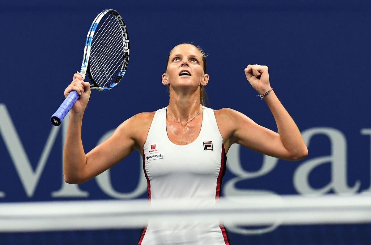 Karolina Pliskova celebrates defeating Serena Williams during their U.S. Open semifinal match at the Billie Jean King National Tennis Center in New York.