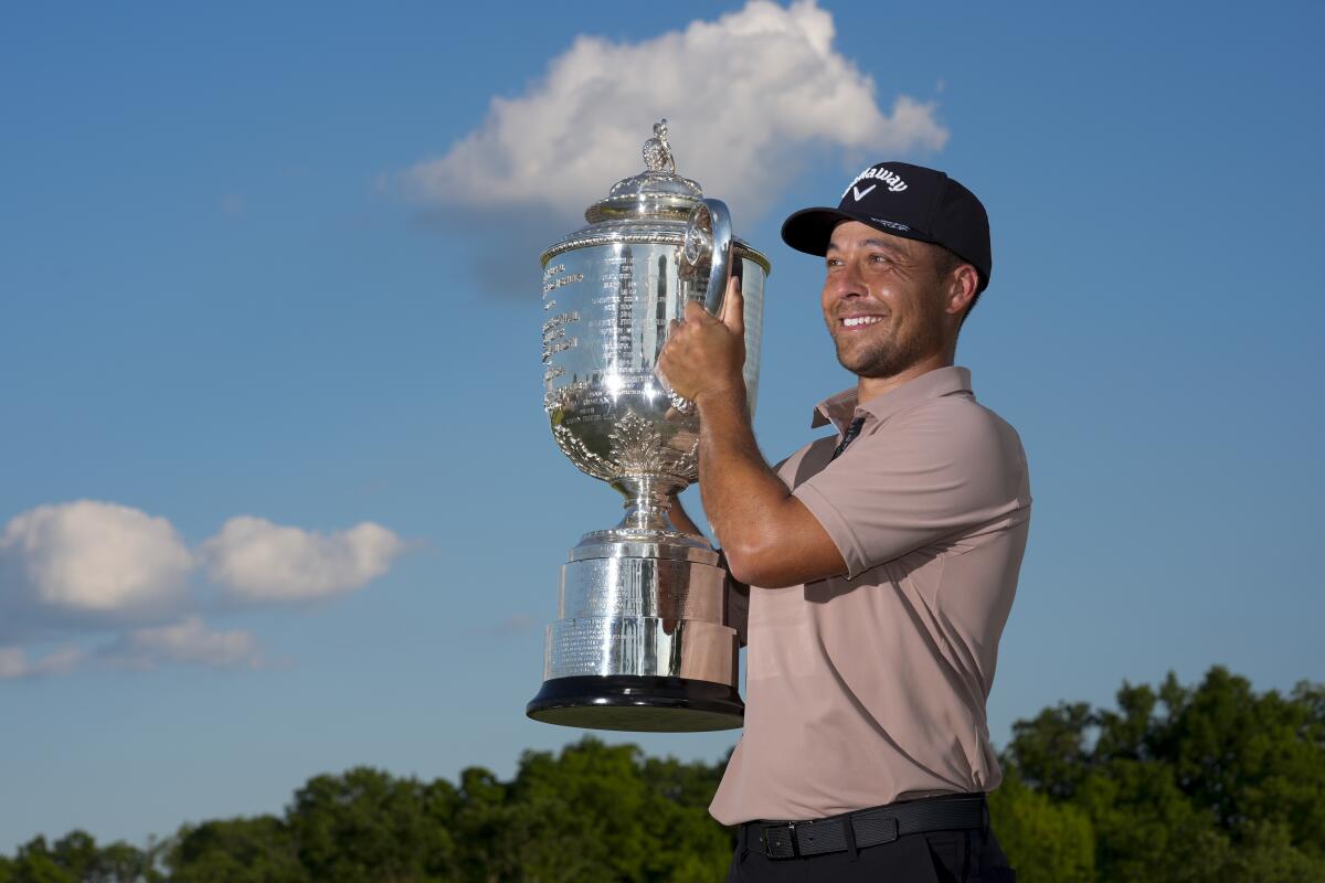 Xander Schauffele holds the Wanamaker Trophy after winning the PGA Championship on Sunday the Valhalla Golf Club.