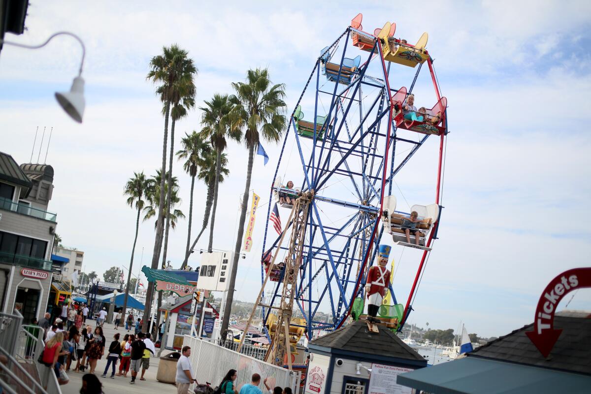 The ferris wheel along the boardwalk at the Balboa Fun Zone in Newport Beach, California.
