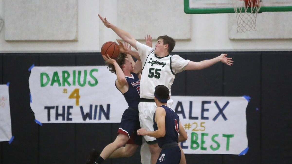Sage Hill School's Johnny King (55) blocks a shot by St. Margaret's Trey Pate during the Academy League championship game on Thursday