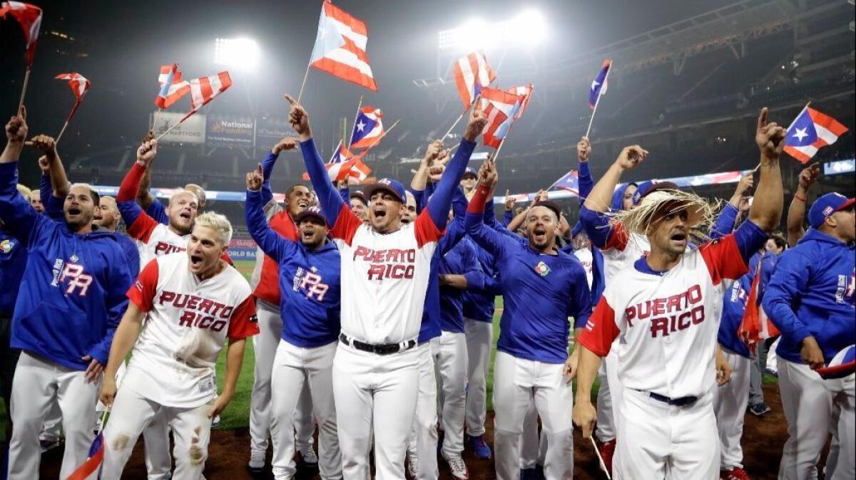 Members of the Puerto Rico team celebrate after defeating the United States, 6-5, in a World Baseball Classic game on March 17.