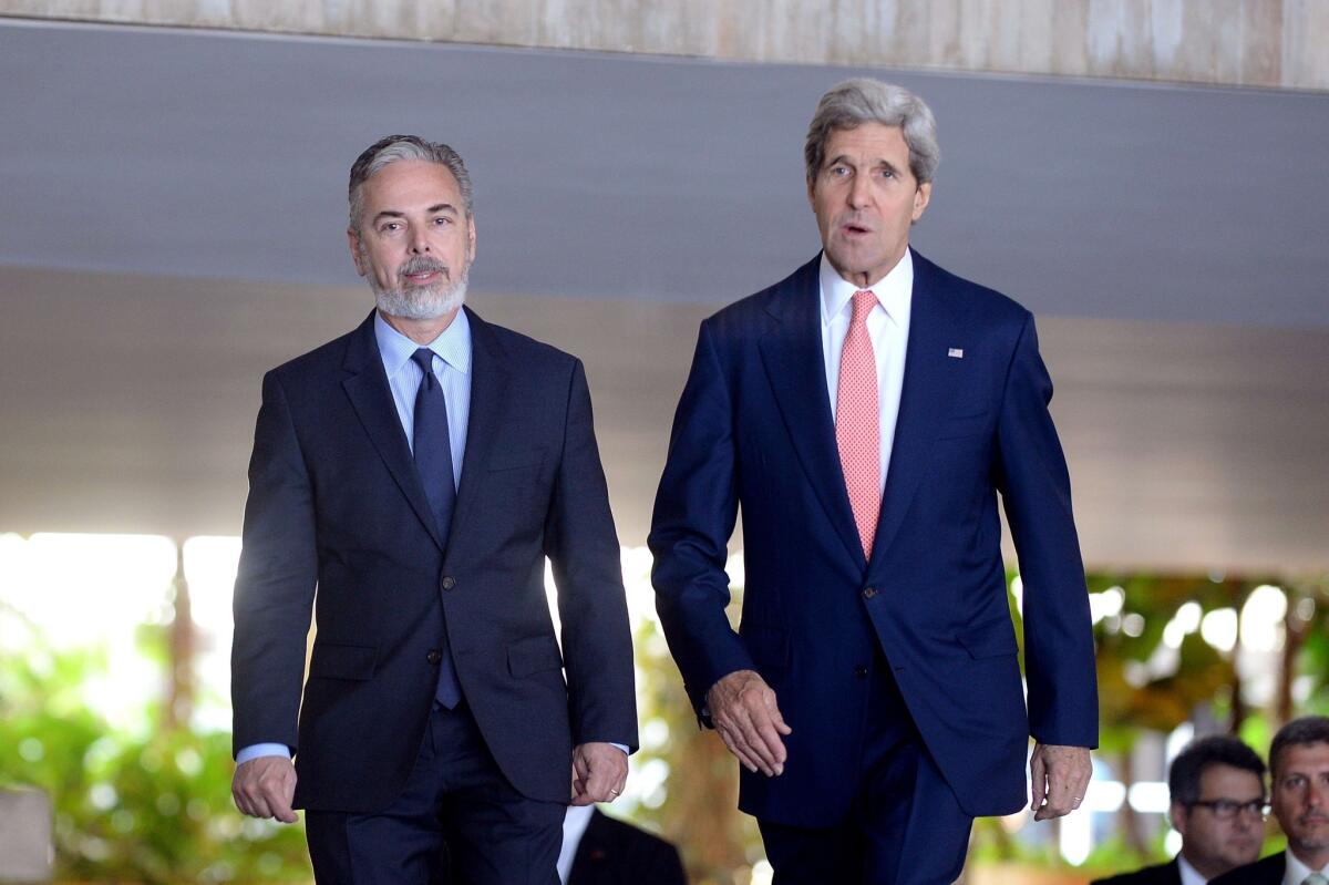 U.S. Secretary of State John F. Kerry, right, encountered some reproach over NSA surveillance programs from Brazilian Foreign Minister Antonio Patriota during their talks in Brasilia on Tuesday. Patriota said the violations of Brazil's sovereignty and individuals' freedoms "must be stopped" or U.S.-Brazil relations would be harmed.