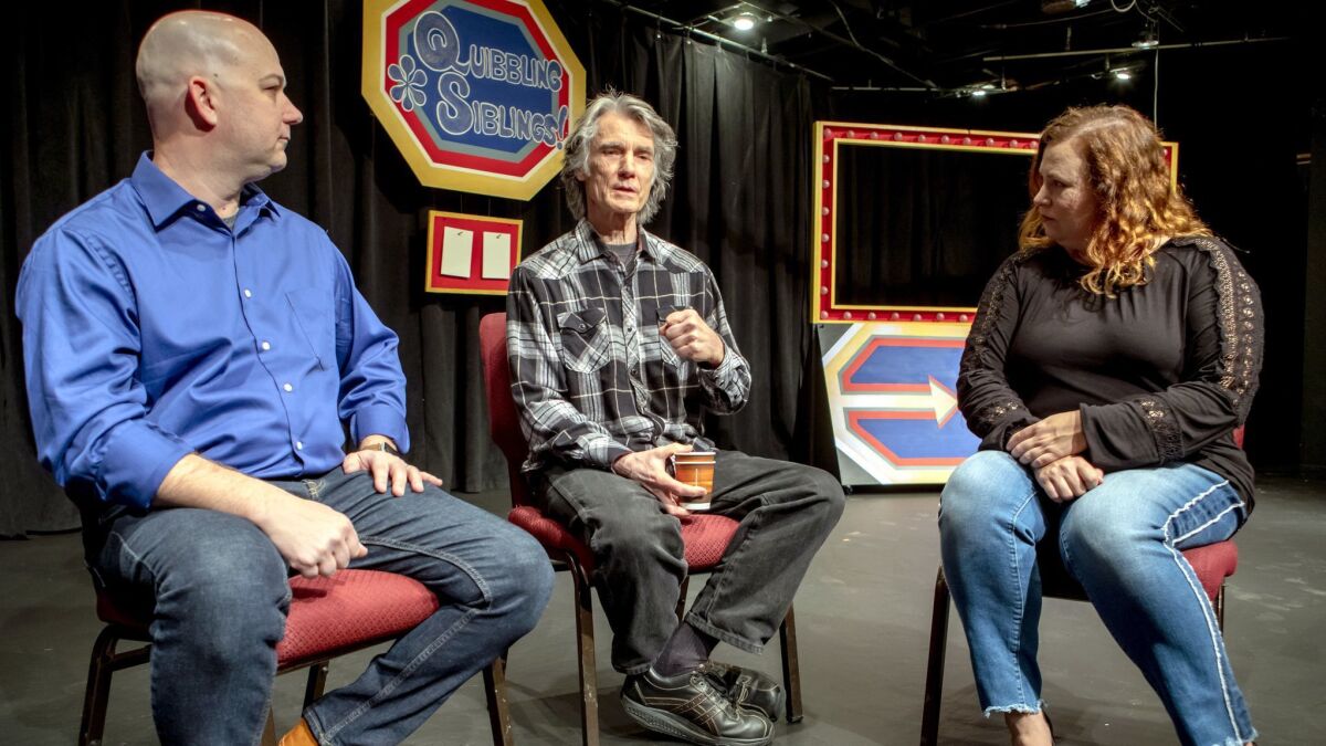 "Luann" comic strip cartoonist Greg Evans, center, on the set of his musical "Quibbling Siblings" with Patio Playhouse's artistic manager Matt FitzGerald and publicity chair Samantha Goldstein.