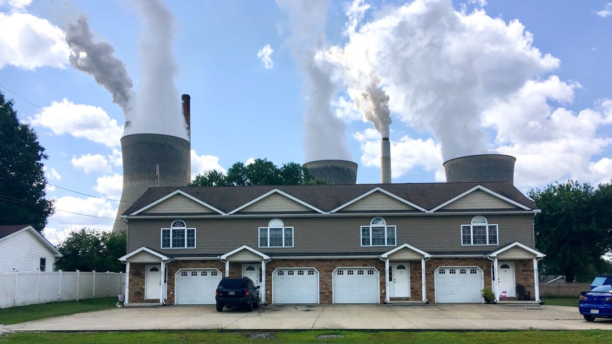American Electric Power's John Amos coal-fired plant in Winfield, W.Va., is seen from an apartment complex in the town of Poca across the Kanawha River on Aug. 23.