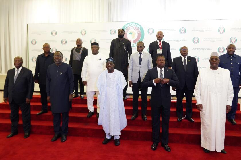 Nigeria's President, Bola Ahmed Tinubu, center first row, poses for a group photo with other West African leaders before an ECOWAS meeting in Abuja, Nigeria. Thursday, Aug. 10, 2023. West African heads of state began meeting Thursday on next steps after Niger's military junta defied their deadline to reinstate the nation's deposed president, but analysts say the bloc known as ECOWAS may be running out of options as support fades for a military intervention. (AP Photo/Gbemiga Olamikan)