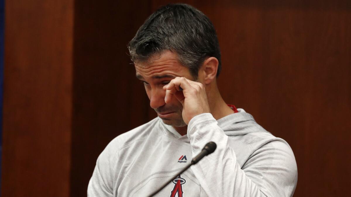 Angels manager Brad Ausmus wipes tears from his eyes as he responds to questions during a news conference about the passing of Tyler Skaggs, before the game against the Texas Rangers in Arlington, Texas on Tuesday.