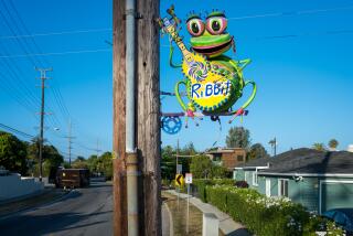 MAR VISTA, CA - Aug. 13, 2024: Sculptures by artist Lori Powers that are affixed to utility poles on Palms Boulevard in Mar Vista. (Michael Owen Baker / For The Times)