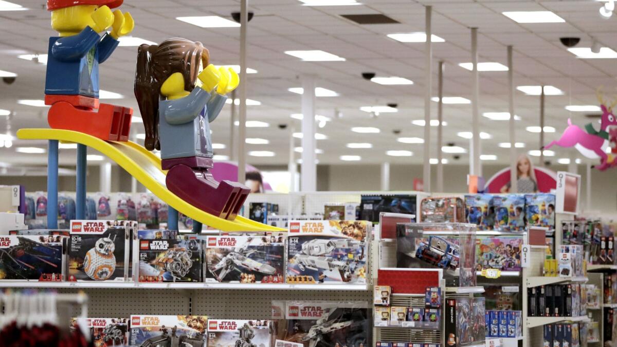 A Target store in Bridgewater, N.J., displays two large Lego toys on a slide near the toy section.