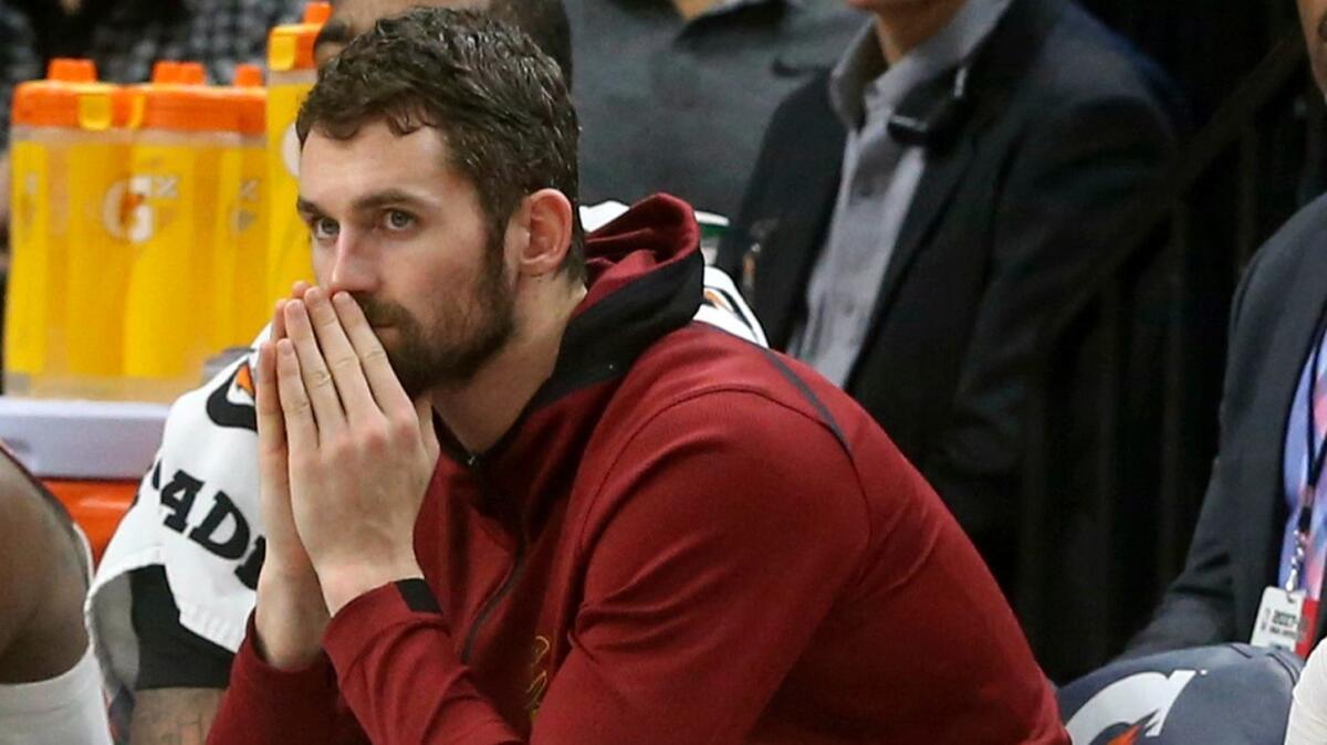 Cleveland's Kevin Love watches from the bench during a game against Minnesota on Jan. 8.