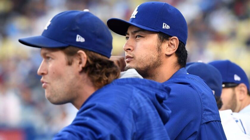The Dodgers have an established ace in Clayton Kershaw, foreground, but the future of fellow pitcher Yu Darvish isn't so clear.