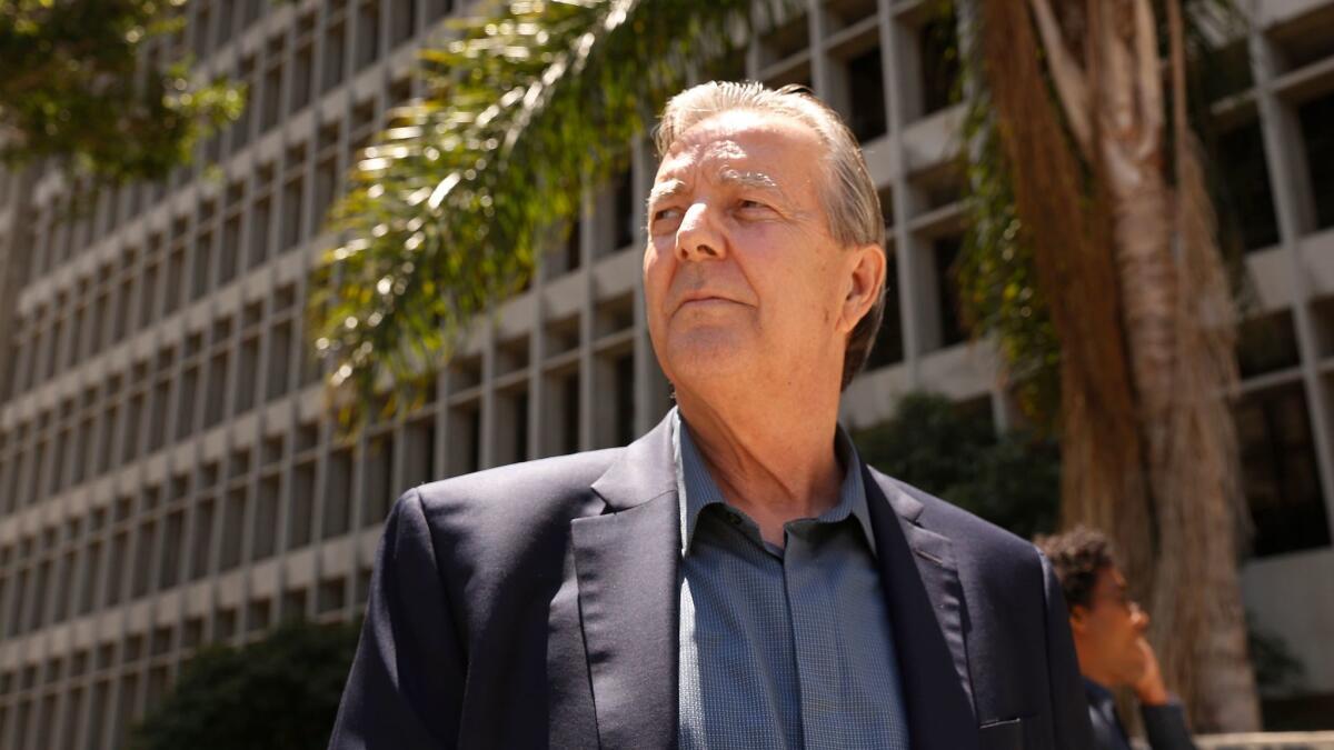 Palmdale Mayor Jim Ledford leaves court in Los Angeles after a hearing last year in his corruption case. Prosecutors filed an additional misdemeanor count against him Wednesday.