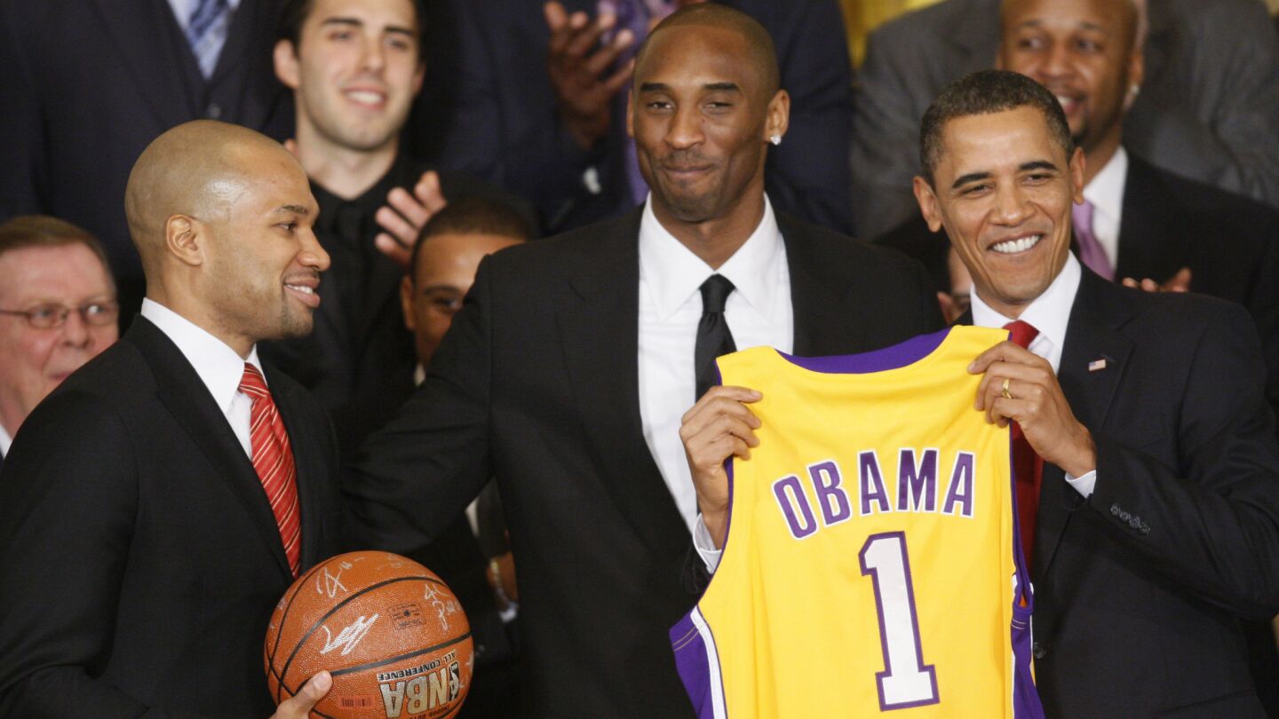 Lakers teammates Derek Fisher, left, and Kobe Bryant, center, give President Barack Obama a personalized team jersey while visiting the White House on Jan. 25, 2010.