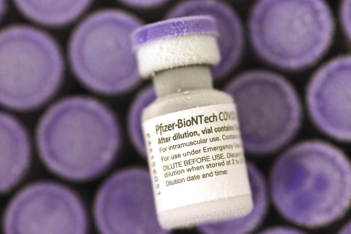Doses of the Pfizer-BioNTech COVID-19 vaccine are shown.