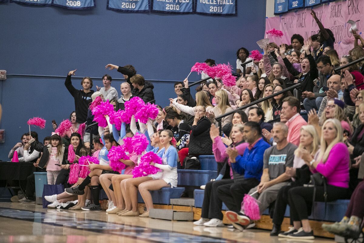 Corona del Mar's fans celebrate during the Battle of the Bay girls' basketball game on Thursday.