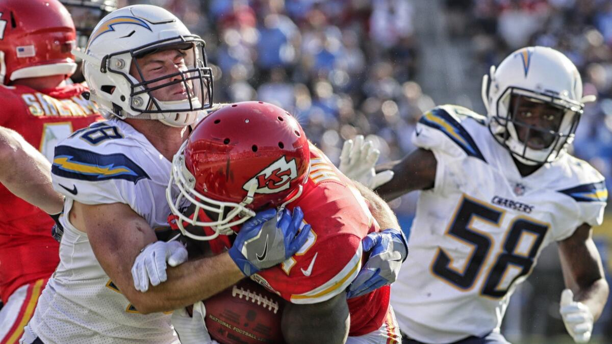 Chargers linebacker Nick Dzubnar tackles Chiefs kick returner Tyreek Hill at StubHub Center.