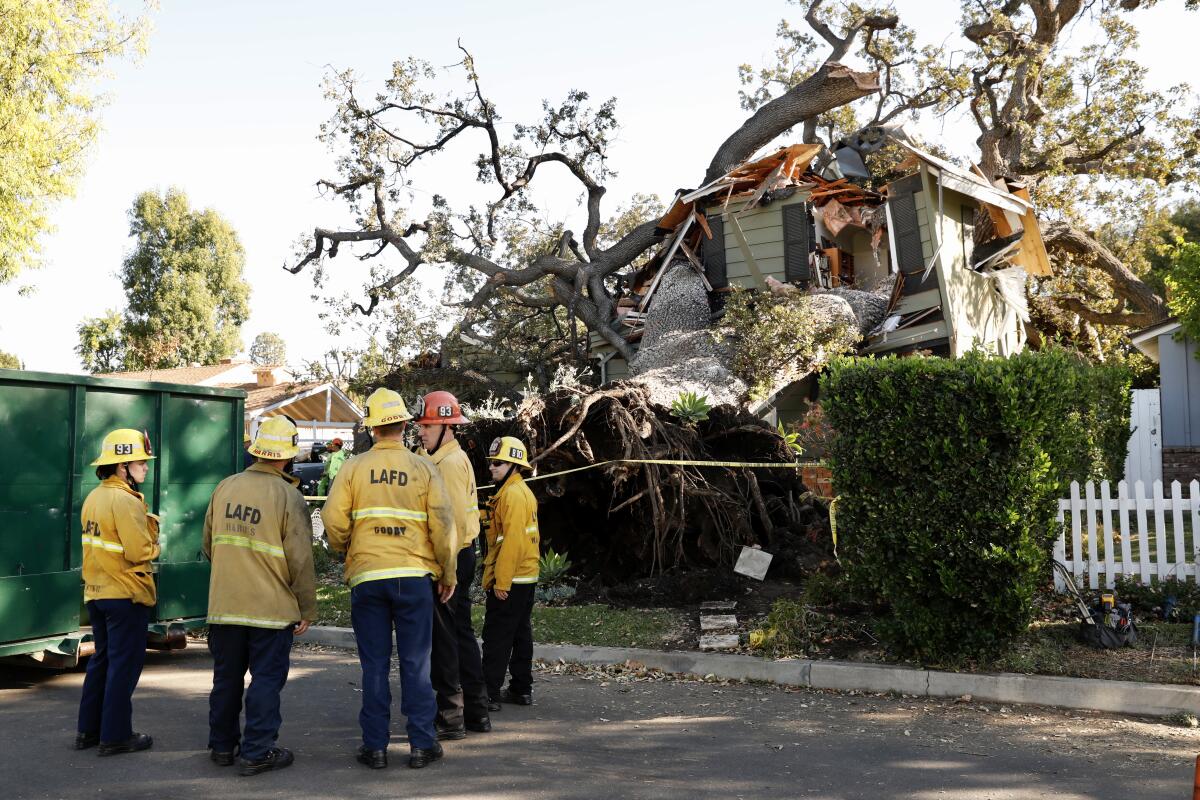 Firefighters respond to house collapse.