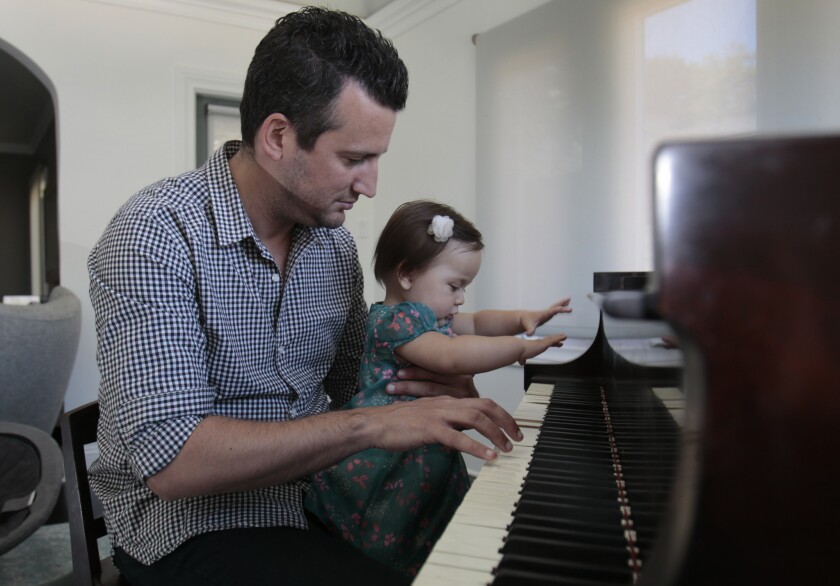 A new study suggests that letting go of executive areas of the brain speeds the learning of motor tasks, such as playing an instrument. That might give the advantage to L.A. Phil principal timpanist Joe Pereira's daughter, Sophia, shown playing along with Dad on Aug. 27, 2014.