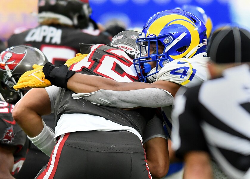 Rams linebacker Kenny Young sacks Buccaneers quarterback Tom Brady in the third quarter.